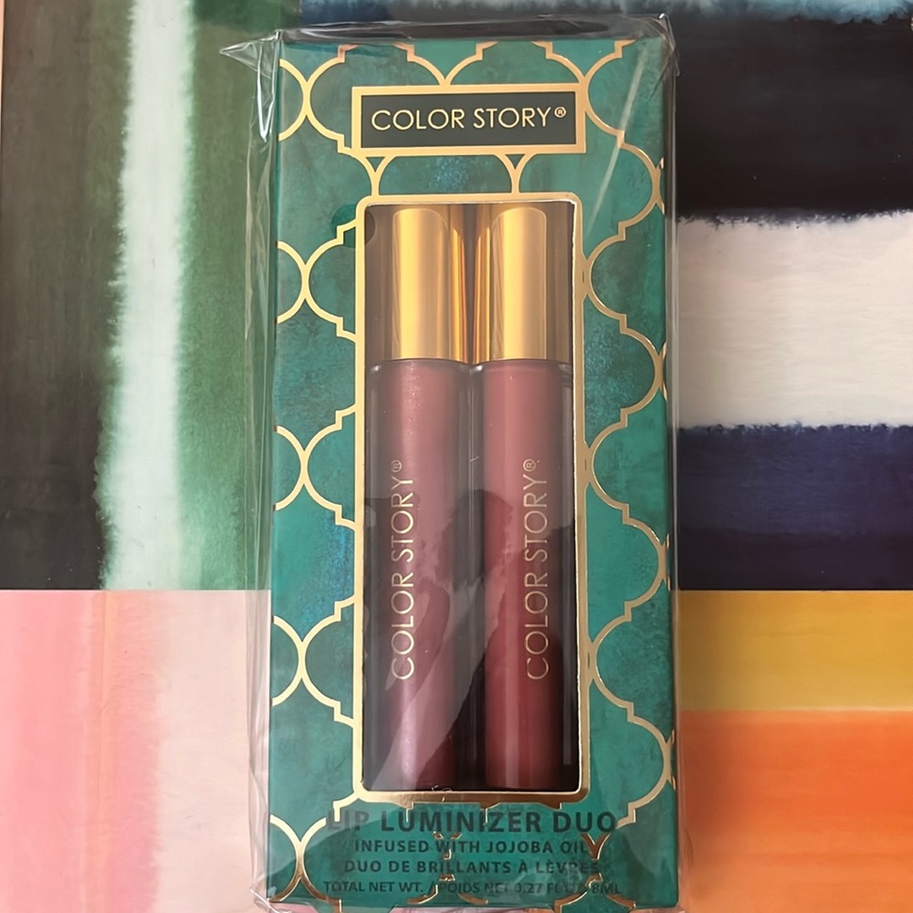 Color Story Lip Gloss Luminizer Duo infused with jojoba oil to moisturiz…